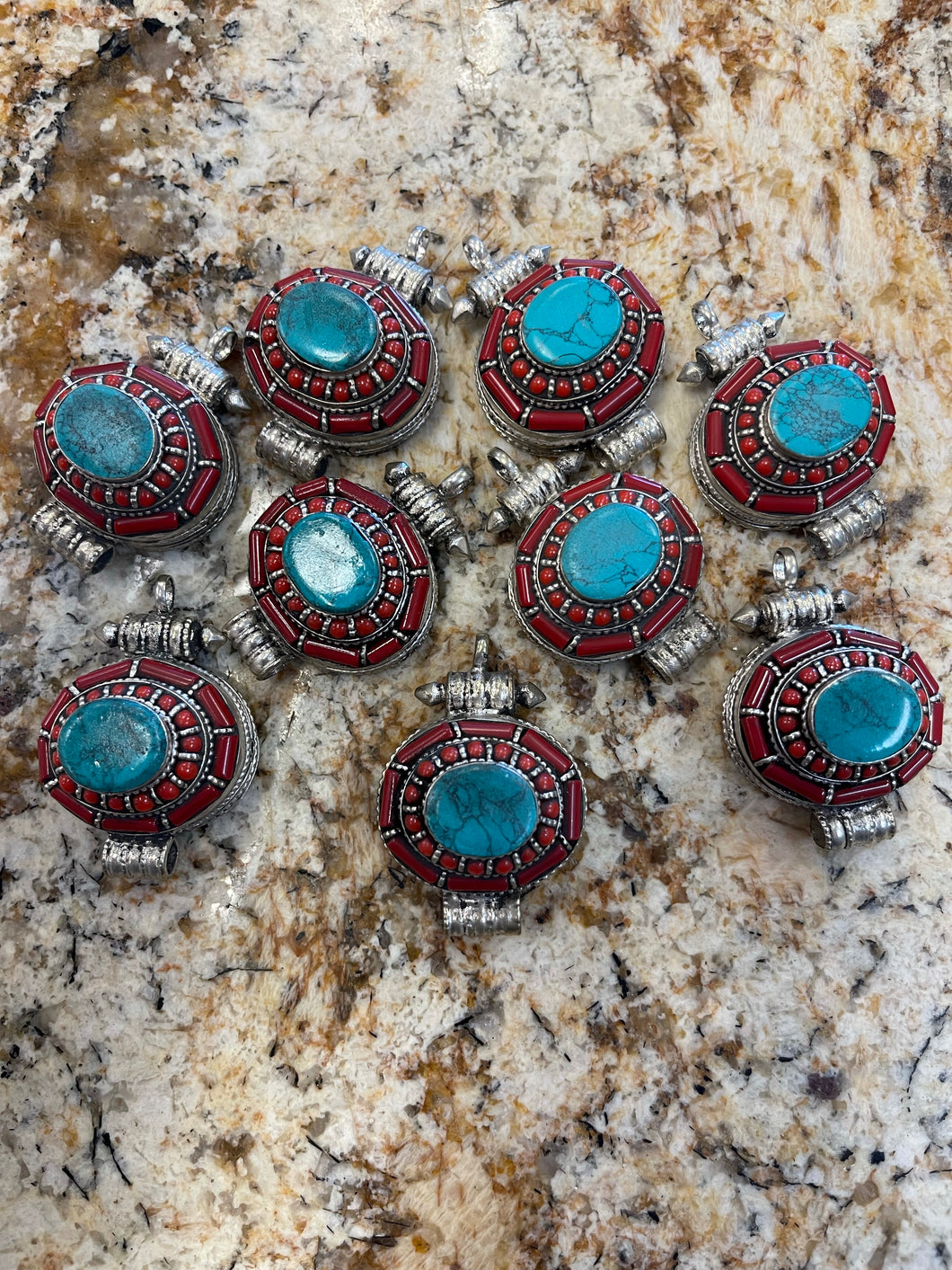 Gau Pendants